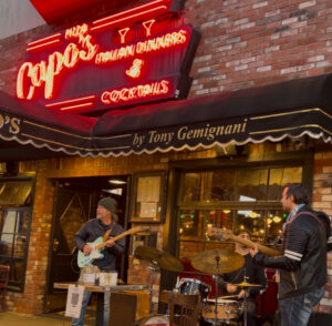 Jose Simioni & Sasha Jacobsen playing in front of Capo's